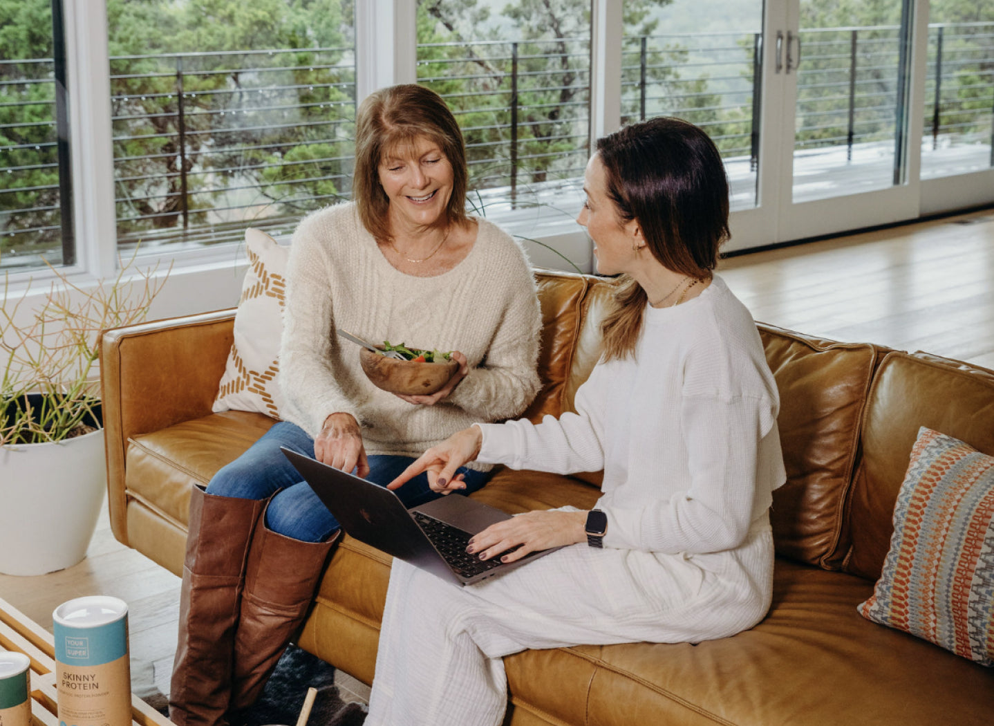 A woman and her adult daughter discussing the Community Reset
